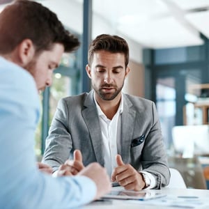 cropped-shot-of-two-young-businessmen-using-a-digital-tablet