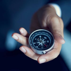 man-holding-a-compass